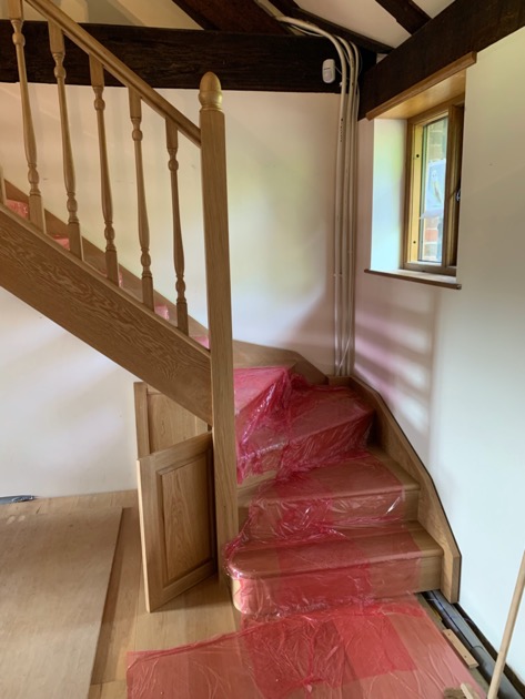 Oak Staircase with bespoke turned spindles fully finished in a spray lacquer