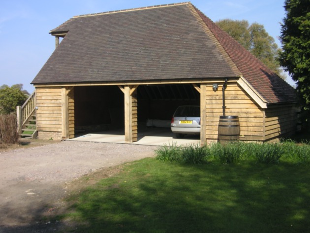 Green Oak Clad Garage with Oak Staircase 